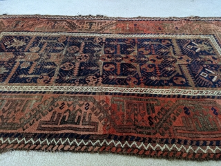 Stunning antique Baluch. 5ft 6in x 3ft 1in. Real unique center panel design. High soft wool except the corroded brown areas. Great colors.

Cheers.          