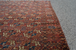 Beautiful 3rd quarter 19th century Tekke main rug. 8ft x 6ft 6in. Unusual minor border and gul. Mostly low pile, one square patch was removed, two tears on one end, and one  ...