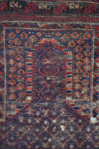 This dukhtar e qazi Baluch prayer rug folds like a cloth and has some of the more intense oxidation I've seen. It's one of the older pieces of this type that I've  ...