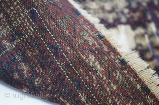 This dukhtar e qazi Baluch prayer rug folds like a cloth and has some of the more intense oxidation I've seen. It's one of the older pieces of this type that I've  ...