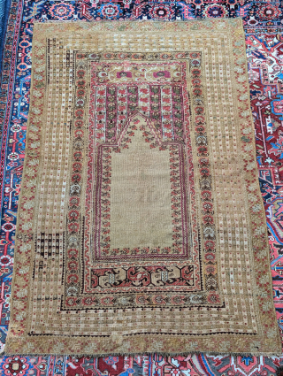 Mid 19th century but likely earlier Ghiordes prayer rug. It has a few small repairs but overall mostly original. 6'0" x 4'4" or 182 x 132 cm. Please contact me at steven.malloch@gmail.com  ...