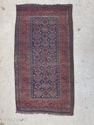 Antique Baluch rug with unusually good purple. 2'9" x 4'11". Selvedge missing on one side but backed by fabric.              
