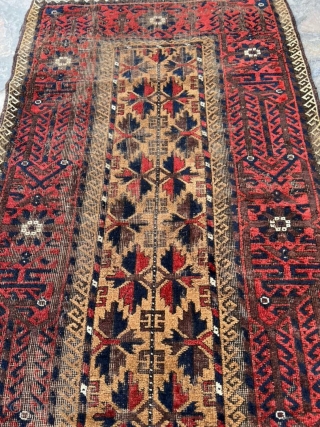 Antique camel hair Baluch rug. 3'0" x 5'2". All ends secured and much of the "wear" is from the oxidized browns. No holes.          