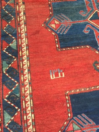 Antique Kazak rug. Beautiful open field with great greens and light blues. Good medium pile throughout. Dated. One old repair which is barely visible from the front.

Cheers.      