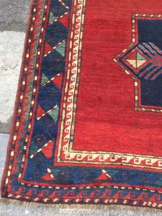 Antique Kazak rug. Beautiful open field with great greens and light blues. Good medium pile throughout. Dated. One old repair which is barely visible from the front.

Cheers.      