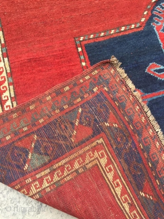 Antique Kazak rug. Beautiful open field with great greens and light blues. Good medium pile throughout. Dated. One old repair which is barely visible from the front.

Cheers.      