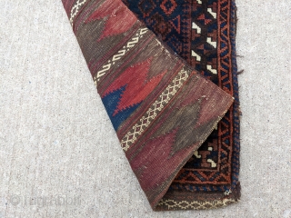 Gorgeous 19th century Baluch balisht. Complete piece with front, back, and goat hair loops. These small bags are a true work of art. 1'6" x 3'2" or 46 x 92cm

Cheers.   