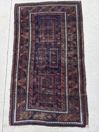 Antique Timuri Baluch rug by the Yaqub Khani subtribe. 3'5" x 6'3" or 104 x 198 cm. Original sides with oxidized dark browns. Many wonderful motifs in the center field of this  ...