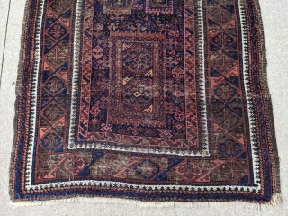 Antique Timuri Baluch rug by the Yaqub Khani subtribe. 3'5" x 6'3" or 104 x 198 cm. Original sides with oxidized dark browns. Many wonderful motifs in the center field of this  ...