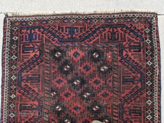 Old Baluch rug. 3'2" x 5'8". Nice range of colors. Ends and sides secured. One finertip sized hole that's been secured.            