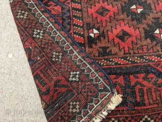 Old Baluch rug. 3'2" x 5'8". Nice range of colors. Ends and sides secured. One finertip sized hole that's been secured.            