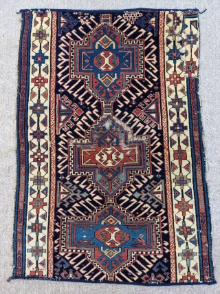 19th Century Caucasian fragment. 2'5" x 3'5" or 74 x 104cm. Beautiful colors and can still be used as a scatter rug or collectible piece as an older one. 

Cheers.   