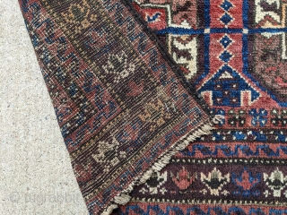 Beautiful old Baluch rug with Tekke guls. Great border, deep blue, and good pile with soft wool. 3'9" x 7' or 114 x 214cm. 

Cheers.        