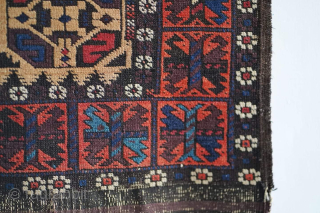 Antique "S" gul Baluch rug with camel hair field. It's a striking piece. It has a few small tears at the ends, visible. Other than that it has no repairs.

Please contact me  ...
