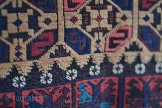 Antique "S" gul Baluch rug with camel hair field. It's a striking piece. It has a few small tears at the ends, visible. Other than that it has no repairs.

Please contact me  ...