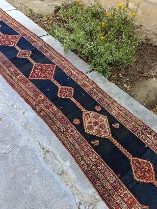 Antique, skinny Kurdish runner. It has a great deep blue field.

2'9" x 13'5" or 84 x 409cm

Please contact me at: steven.malloch@gmail.com or gerrerugs@gmail.com          