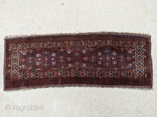 19th Century Yomud torba. 1'5" x 3'9" or 43 x 114cm. Typical dark purplish brown field. No repairs and even low pile with shiny wool. Nice polychromatic blue and good greens.

Cheers.  