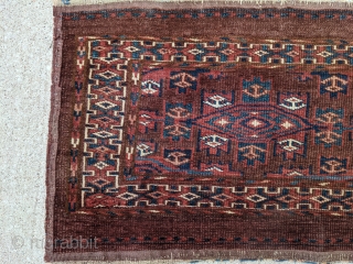 19th Century Yomud torba. 1'5" x 3'9" or 43 x 114cm. Typical dark purplish brown field. No repairs and even low pile with shiny wool. Nice polychromatic blue and good greens.

Cheers.  
