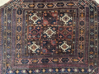 Old Baluch saddle cover. 2'10" x 3'5". Small silk highlights, overall good pile. Original sides except the bottom right corner. One small area of moth damage photographed.

Cheers.      