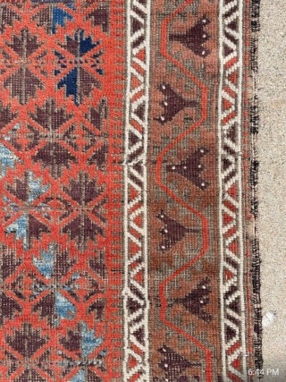 Antique symmetrically knotted Baluch rug with 11 colors and a striking light blue. The bottom edge wasn't cut, the weaver decided to shorten the two outer borders. No holes. 

2'8" x 5'0"  ...