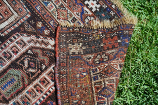 Very whimsy, old (probably) Shiraz rug. It has everything, boteh, humans, peacocks, a camel, goats, birds, etc. It has had some repiling in the lower left mostly near the borders.

5'0" x 5'6"  ...