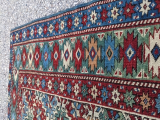 Beautiful antique Kazak rug with ample amounts of green. 3'4" x 4'5"                     