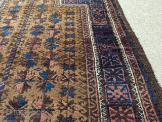 Antique Baluch camel ground prayer rug, possibly Timuri. Tight weave, soft wool with a very floppy handle. Great range of colors. Love the dark blues in this. 3'0 x 4'6".

Cheers   