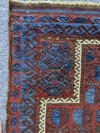 Antique Baluch prayer rug with an unusual amount of glowing blue. There's a nice aubergine with fluffy wool and a loose handle. Contact me at: steven.malloch@gmail.com or gerrerugs@gmail.com     