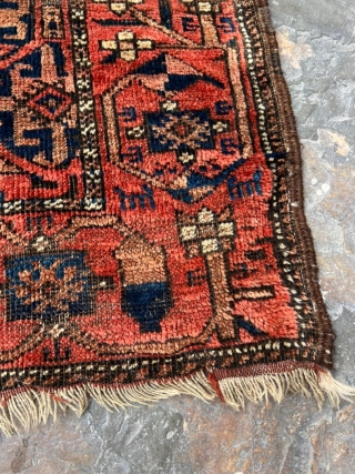 Colorful antique Baluch rug with some animal motifs in the flower border. 3'4" x 5'9".                  