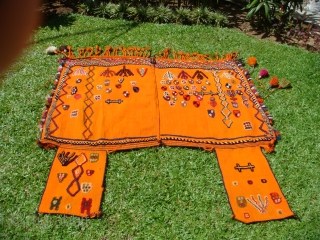 Early 20th Century Q'ashqai Camel Blanket with Decorative symbols and motifs of Stylized Tree Shrubs, Water and Flower Petals. Materials: Wool on Wool on Orange-coloured Ground. In very good condition, consistent with  ...