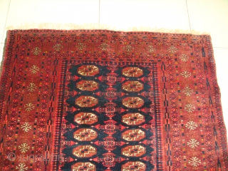 Original, Early 20thC. Afghan Turkmen "Blue" Bokhara. (It is neither of Baluch nor of Pakistani provenance.)
As described by J.K. Mumford in his book "Oriental Rugs" (Bramhall House 1981 edition): "Very rarely a  ...