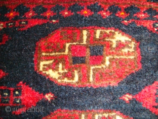 Original, Early 20thC. Afghan Turkmen "Blue" Bokhara. (It is neither of Baluch nor of Pakistani provenance.)
As described by J.K. Mumford in his book "Oriental Rugs" (Bramhall House 1981 edition): "Very rarely a  ...