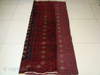 Original, Early 20thC. Afghan Turkmen "Blue" Bokhara. (It is neither of Baluch nor of Pakistani provenance.)
As described by J.K. Mumford in his book "Oriental Rugs" (Bramhall House 1981 edition): "Very rarely a  ...