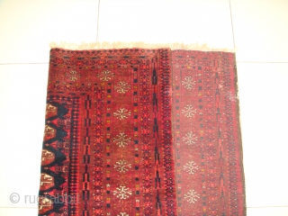 Original, Early 20thC. Afghan Turkmen "Blue" Bokhara. (It is neither of Baluch nor of Pakistani provenance.)
As described by J.K. Mumford in his book "Oriental Rugs" (Bramhall House 1981 edition): "Very rarely a  ...