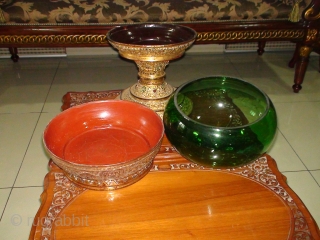 A 3-piece, early 20thCentury Burmese "Hsun-oke" with Glass Bowl (Food Carrier used in collecting Alms). Bamboo Top and Base sections, Lacquered and Gilded with coloured mirror-glass inlay.
Provenance: Likely crafted in Bagan before  ...