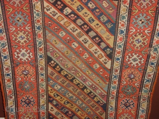 wonderful antique 1880 gendjeh rug, wonderful natural colors, great fuchsia color also, 
some minor low pile, two small repairs, complete headends, two deliberate incisions, to make it lay perfectly flat, no stains

110x263cm
3.7x8.8ft 