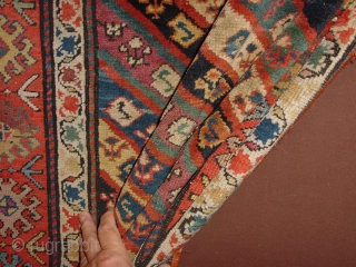 wonderful antique 1880 gendjeh rug, wonderful natural colors, great fuchsia color also, 
some minor low pile, two small repairs, complete headends, two deliberate incisions, to make it lay perfectly flat, no stains

110x263cm
3.7x8.8ft 