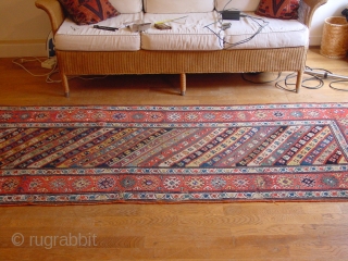 wonderful antique 1880 gendjeh rug, wonderful natural colors, great fuchsia color also, 
some minor low pile, two small repairs, complete headends, two deliberate incisions, to make it lay perfectly flat, no stains

110x263cm
3.7x8.8ft 