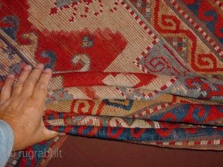 very old kazak, ca 1850, great size 166x212cm  5.5x7.1ft, all ends, beautifully secured, impressive design, great natural colors, the wool used for repiling is faded, 
the rug is clean and ready  ...