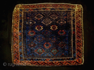 1880 Very Fine Baluch Bagface
Size: 64x56cm (2.1x1.9ft)
Natural colors (except one color at the star pattern is faded)
                