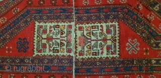 Antique East Turkestan saddle rug made of two pieces stitched together, probably Yarkand. Has very clear Turkemen design elements which is uncommon. Size is 120x54 cm (47×21 inches).     