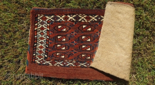 Antique Turkmen Yomud group complete torba with back. In very good condition. Size is: 40x78cm (ca. 15.7x30.7 inches). Great all natural dyes and rare design elements. Upper and lower borders different than  ...