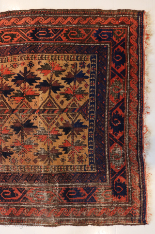 Ca. 1900 Baluch Prayer Rug. 180 x 99 cm. The dark blue and orange colours stand out amongst the warm yellow field with wear over the years that makes this rug more  ...