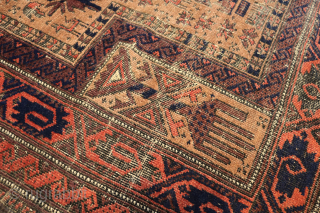 Ca. 1900 Baluch Prayer Rug. 180 x 99 cm. The dark blue and orange colours stand out amongst the warm yellow field with wear over the years that makes this rug more  ...