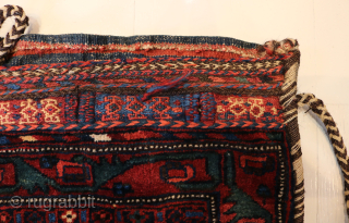 Ca.1910. Afshar Bag. 84 x 60 cm. This bag exhibits the skilled craftsmanship of the Afshar tribe in Persia. The weaving with the embroidered borders, the tassels with Goats hair, the braiding  ...