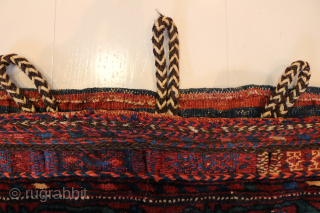 Ca.1910. Afshar Bag. 84 x 60 cm. This bag exhibits the skilled craftsmanship of the Afshar tribe in Persia. The weaving with the embroidered borders, the tassels with Goats hair, the braiding  ...