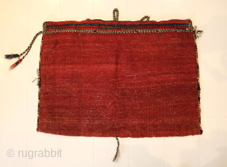 Ca.1910. Afshar Bag. 84 x 60 cm. This bag exhibits the skilled craftsmanship of the Afshar tribe in Persia. The weaving with the embroidered borders, the tassels with Goats hair, the braiding  ...