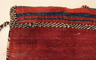 Ca.1910. Afshar Bag. 84 x 60 cm. This bag exhibits the skilled craftsmanship of the Afshar tribe in Persia. The weaving with the embroidered borders, the tassels with Goats hair, the braiding  ...