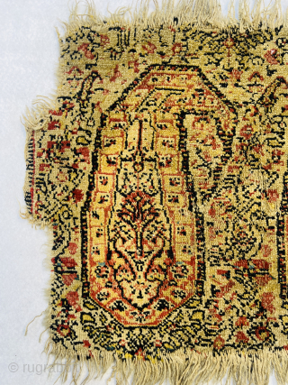 "Antique Kurdish senneh Sample (wagireh), early 18th Century, featuring two golden boteh motifs. This piece was used as a trial or reference for larger rug production, typically woven with the same materials  ...