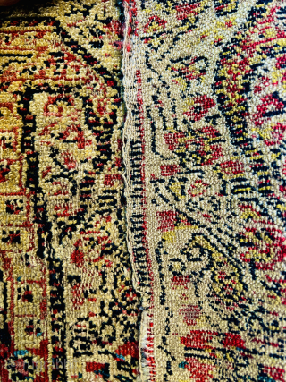 "Antique Kurdish senneh Sample (wagireh), early 18th Century, featuring two golden boteh motifs. This piece was used as a trial or reference for larger rug production, typically woven with the same materials  ...